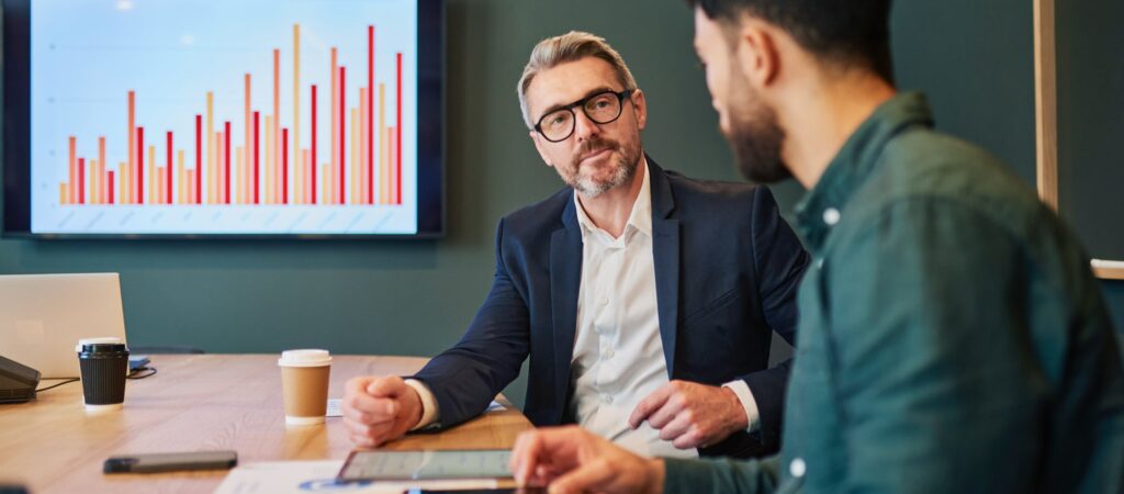 Freedom Capital Solutions mortgage broker reviews bar chart with client in office